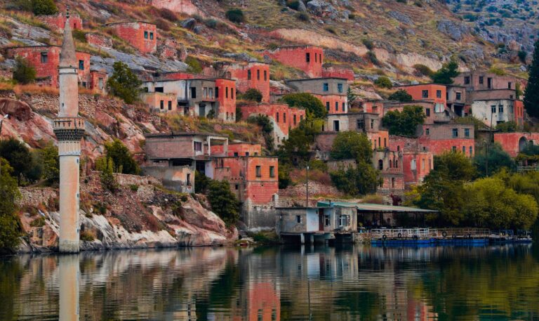 Explore the mysterious sunken town of Halfeti with its historic ruins along the tranquil lake.