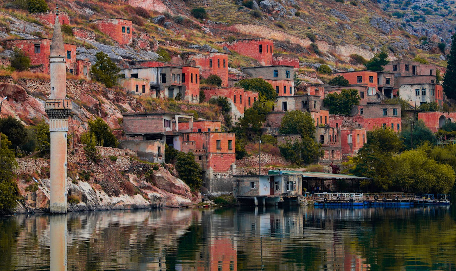 Explore the mysterious sunken town of Halfeti with its historic ruins along the tranquil lake.